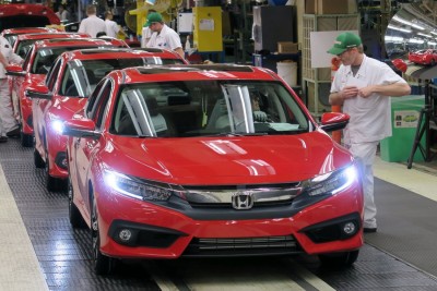 Honda of Canada Mfg. associates perform final inspections on an